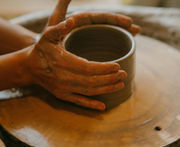 Crafting a handmade ceramic mug on a pottery wheel